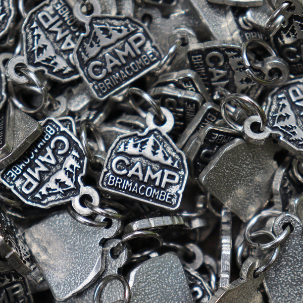 Pile of Camp Brimacombe Charms